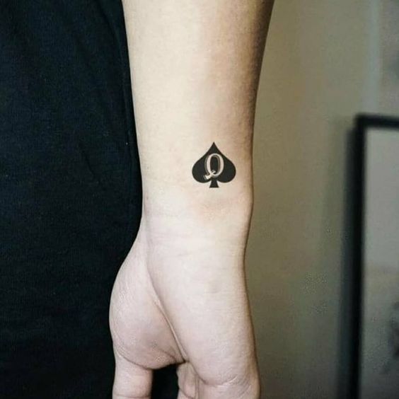 Minimalistic Q-Spade Tattoo design