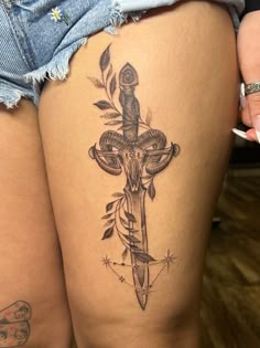 Symbolic Thigh Tattoo