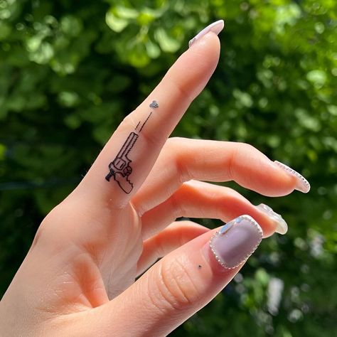 Women's finger tattoo