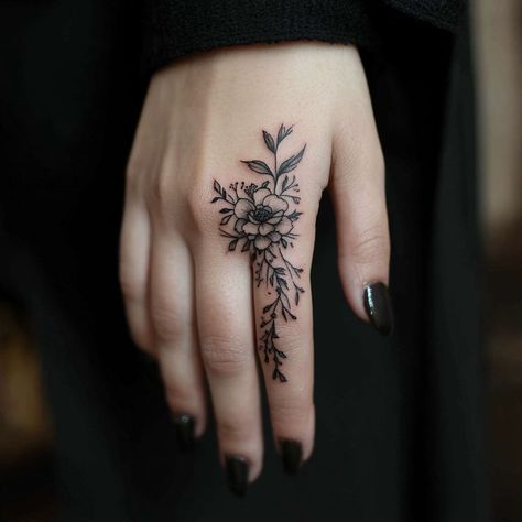 Women's finger tattoo