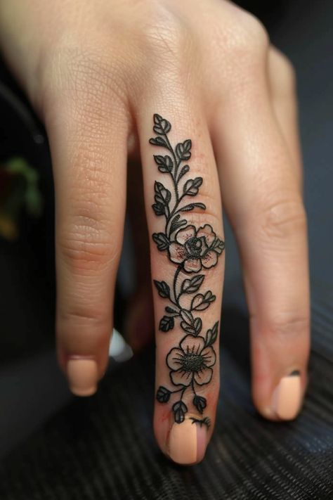 Women's finger tattoo