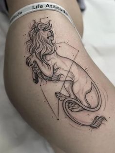 Symbolic Thigh Tattoo