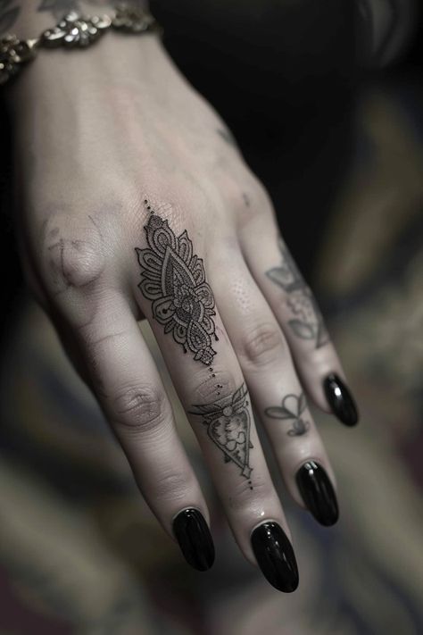 Women's finger tattoo