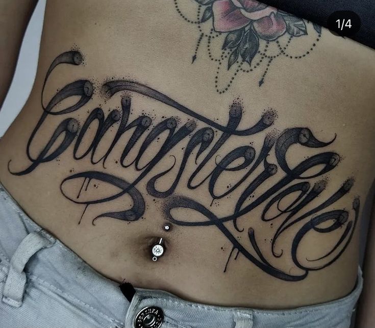 Cursive writing tattoo at Stomach design