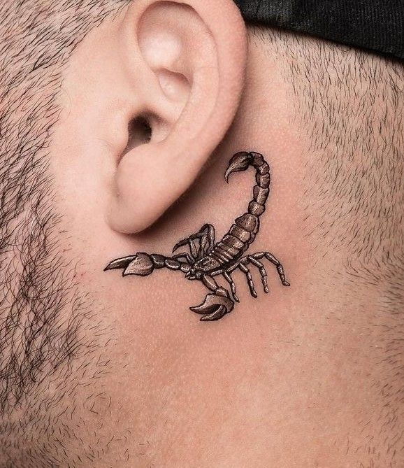 Tiny Scorpion Tattoo at ear